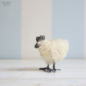 Wired hen with white wool