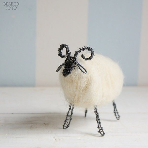 Wired ram with white wool