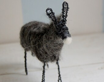 Wired donkey from dark wool