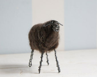 Wired sheep with dark wool