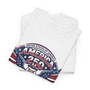 White t-shirt with "America 250" eagle logo and patriotic stars and stripes.