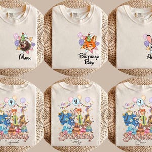 K&ouml;nnte beinhalten: Cremefarbene T-Shirts mit Cartoon-Charakter-Designs und Text. Die Shirts zeigen Charaktere mit Text wie "Mark", "Birthday Boy" und "Amber". Andere Shirts haben eine Gruppe von Charakteren mit dem Text "Birthday Squad", "Birthday Boy" und "Birthday Crew".