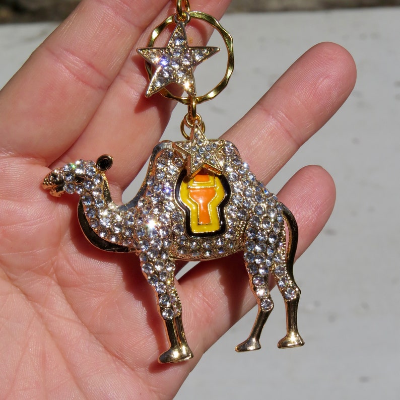 The CAMEL/'S STAR Gold Rhinestone Camel Christmas Ornament