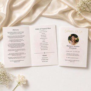 May include: A funeral programme booklet featuring a white cover with the text Celebration of Life, a circular photograph of a person, and the name Margaret Eleanor Whitmore. The interior pages display an obituary and an Order of Funeral Mass.