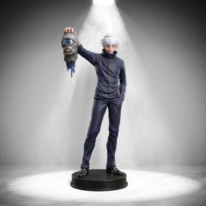 May include: A standing anime-style figurine of a character with spiky white hair, wearing a dark blue high-collar jacket and matching trousers. The figure holds a detached, grey, one-eyed monster head with blue iris and dripping blue liquid.