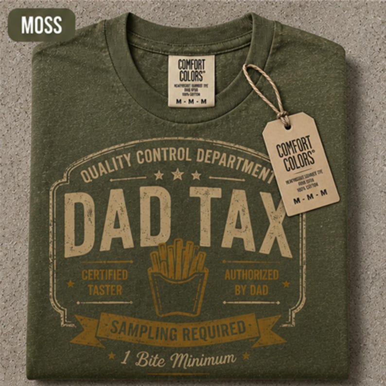 May include: A moss green crew neck t-shirt featuring a graphic print that reads "QUALITY CONTROL DEPARTMENT DAD TAX" with an illustration of french fries. The text includes "CERTIFIED TASTER," "AUTHORIZED BY DAD," and "SAMPLING REQUIRED 1 Bite Minimum."