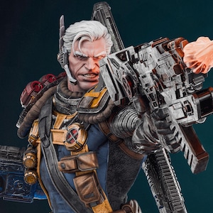 May include: A detailed statue of a character with white hair, a stern expression, and a cybernetic eye. The figure is clad in a blue and brown tactical suit, holding a large, futuristic weapon. The weapon is firing an orange blast.