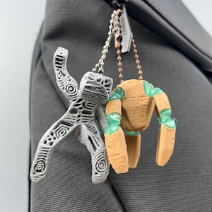 Project Hail Mary Rocky keychain charm with poseable articulated legs and transparent green Eridian joints