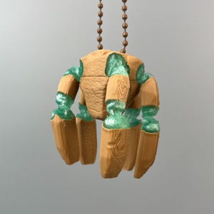 Project Hail Mary Rocky alien bag charm beside Kindle and cozy sci fi reading setup