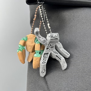Project Hail Mary Rocky charm with floppy articulated legs used as backpack accessory and phone charm