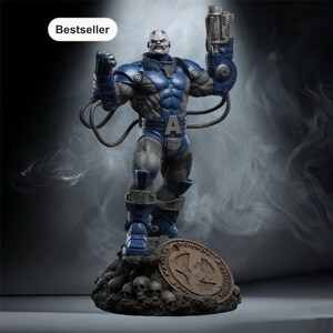 May include: A detailed action figure of Apocalypse, a character from the X-Men comics. The figure is predominantly blue and gray, with intricate detailing. It stands on a base with skulls and a bronze-colored emblem. The figure is holding a weapon.