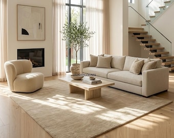 Tappeto in lana trapuntato a mano color beige avena, tappeto minimalista per soggiorni moderni.
