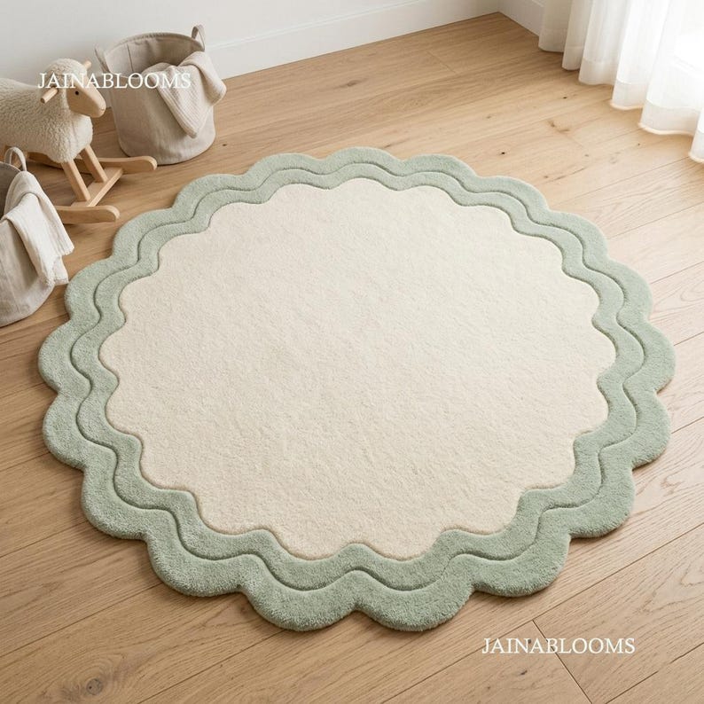 Hand tufted scalloped round rug in sage green and ivory, soft nursery area rug, modern handmade statement carpet by JAINABLOOMS
