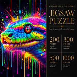 Op de afbeelding: Een legpuzzeldoos met een kleurrijke slangenkop tegen een zwarte achtergrond met neon verfdruppels. De tekst luidt: CHOOSE YOUR CHALLENGE JIGSAW PUZZLE, Four piece counts. One beautiful escape. 200, 300, 500 en 1000 stukjes zijn beschikbaar.