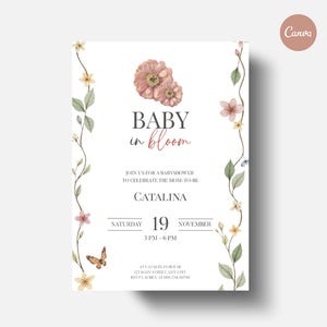 Op de afbeelding: Een witte uitnodiging voor een babyshower met bloemen en een vlinder. De tekst luidt "BABY in bloom" met details over het evenement, inclusief de datum: zaterdag 19 november, van 15.00 tot 18.00 uur. Het ontwerp is elegant.