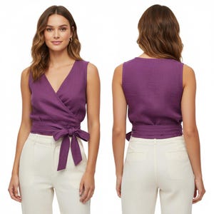 May include: A sleeveless wrap top in a deep purple hue, featuring a V-neckline and a fabric tie closure at the waist. The garment is shown from both the front and back views, highlighting the wrap-around design and the tied bow detail.
