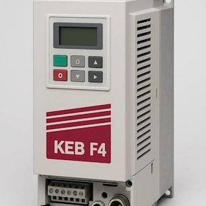 May include: A rectangular, off-white industrial control unit with a digital display and control buttons. The unit features a red and white logo that reads "KEB F4". The side has ventilation slots and a series of connection ports at the bottom.