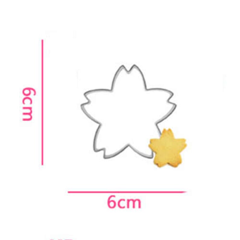 May include: A stainless steel cookie cutter shaped like a five-pointed star flower. The cutter measures 6 inches in diameter. A cookie cut with the cutter is shown next to it.