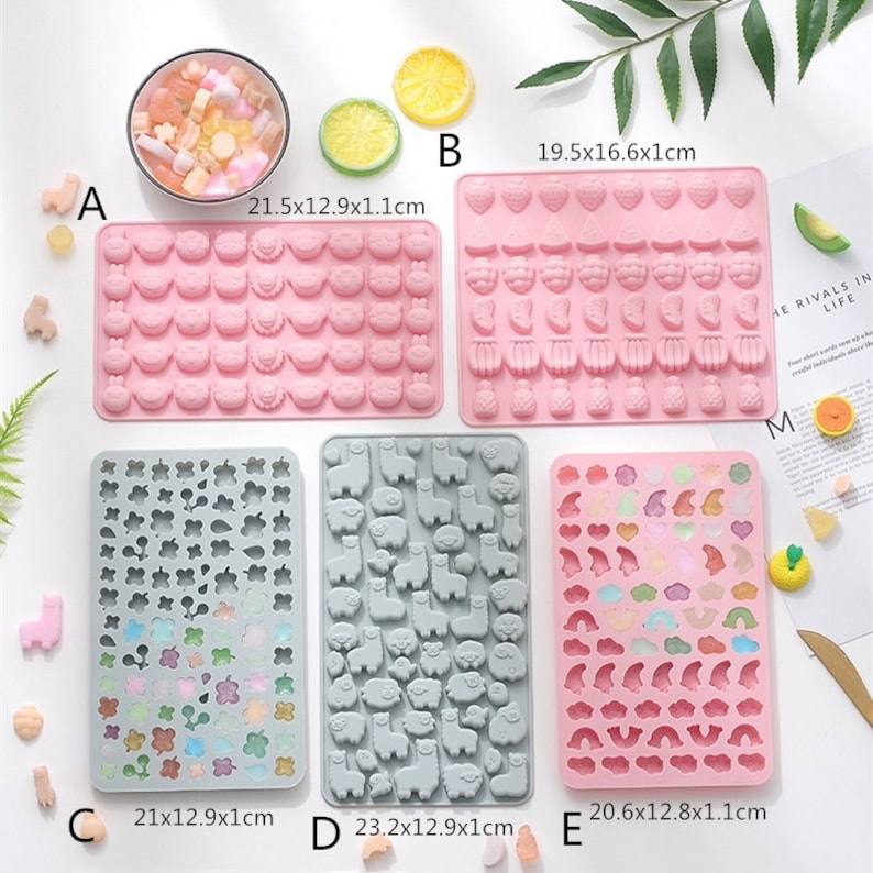 May include: Nine silicone moulds for making candy or chocolate. The moulds are in various colours and feature different designs, including animals, flowers, hearts, and stars. The moulds are labelled with letters A through E and measurements in centimetres.
