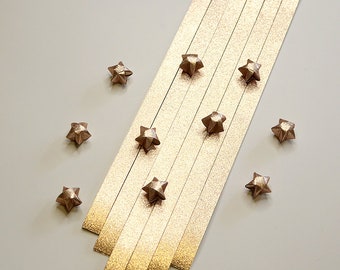 Tiras de papel de origami con polvo de hadas color champán y estrellas de la suerte (paquete de 80)