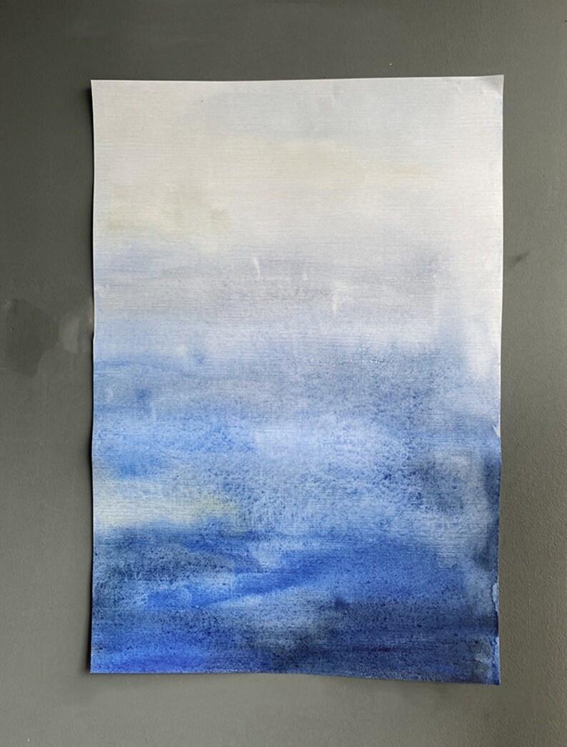 May include: A watercolour painting of a blue sky with white clouds. The sky is painted in shades of blue, from light blue at the top to dark blue at the bottom. The clouds are white and fluffy.