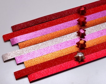 Tiras de papel de origami con polvo de hadas y estrellas de la suerte en tonos rojos (paquete de 80)