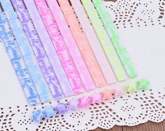 Tiras luminosas de papel con forma de estrella de la suerte que brillan en la oscuridad: elige tu color