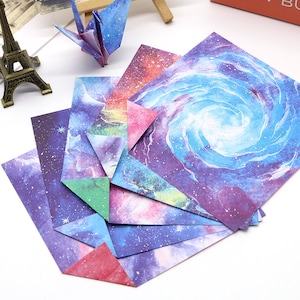 Confezione da 52 fogli di carta quadrata per origami con cielo stellato ad acquerello a doppia faccia per progetti di carta origami - carta di sfondo galassia 15 cm x 15 cm