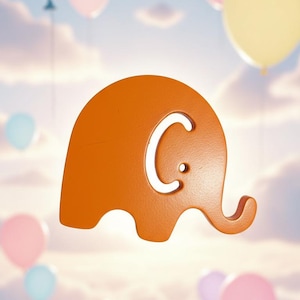 May include: An orange elephant-shaped cutout with a white 'C' in the centre, set against a backdrop of pastel-coloured balloons and a cloudy sky. The elephant has a trunk and a rounded body.