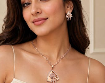 Elegant A.D. diamanthänge i roséguld med matchande örhängen