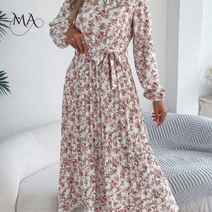 Vestido midi de mujer con estampado floral, pliegues, corte en A, cuello alto, manga larga y cintura ajustada. imagen 13