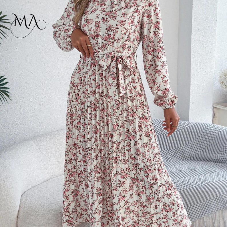 Vestido midi de mujer con estampado floral, pliegues, corte en A, cuello alto, manga larga y cintura ajustada. imagen 13