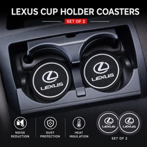 May include: A set of two black circular cup holder coasters featuring the white Lexus logo and text. The coasters have a textured surface and are shown inside a vehicle cup holder. Text includes LEXUS CUP HOLDER COASTERS, SET OF 2, NOISE REDUCTION, DUST PROTECTION, and HEAT INSULATION.