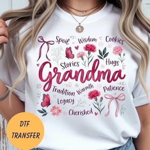 May include: White t-shirt with a floral and butterfly design. The word "Grandma" is in the center, surrounded by words like "Spoil", "Wisdom", and "Cookies". The shirt also has the text "DTF TRANSFER" in a yellow circle.