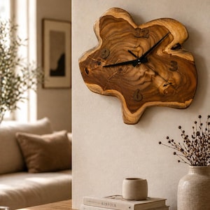 May include: A unique wall clock crafted from a natural wood slab, featuring a freeform shape and visible wood grain. The clock has black hands and simple numerals. The clock is mounted on a neutral-colored wall, adding a rustic touch to the decor.