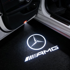 May include: A handmade wooden sign with the text "Welcome" in a playful font. The sign features a distressed white background and a dark brown frame, perfect for a front door or entryway. The sign measures approximately 12 inches wide and 6 inches tall.