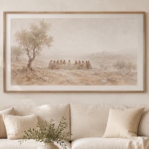 May include: A horizontal framed wall art print depicting a neutral-toned landscape scene of the Last Supper. The artwork features a group of figures seated at a long table in an open, arid field with sparse trees, rendered in soft beige and brown hues.