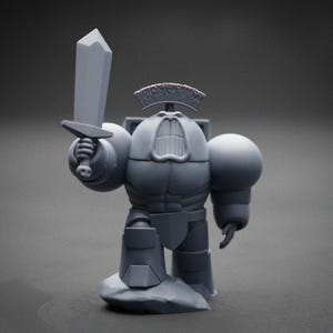 May include: A grey figurine of a robot warrior holding a sword. The robot has a crown-like headpiece, large rounded shoulders, and a stylized mouth. The figure is standing on a rock-like base.
