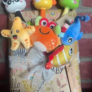 May include: A set of three ceramic mugs with a speckled, matte finish. The mugs are in shades of cream, light gray, and dark gray. Each mug has a simple, minimalist design, perfect for coffee or tea.