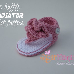 May include: Pink and white crocheted baby sandals with a ruffle detail. The sandals have a button closure and the text "The Ruffle GLADIATOR Crochet Pattern" is visible above the sandals.