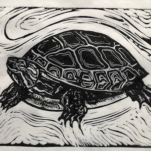 May include: Black and white linocut print of a turtle with a detailed shell pattern. The turtle is swimming in a swirling pattern of water.