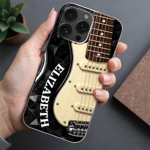 May include: A phone case with a guitar design and the name "ELIZABETH" in white. The case has a black geometric pattern on the left and a detailed guitar image on the right, with a cream-colored body.