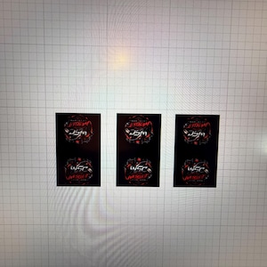 May include: Three black rectangular stickers with red and white text. The top text reads "JITTERBUG" in a stylized font, and the bottom text reads "WSC VAULT". The stickers are on a light grey surface.
