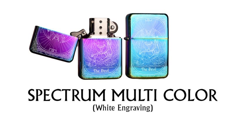 May include: Spectrum multi-color lighter with white engraving. The lighters have a gradient finish with purple, blue, and green hues. The design features an illustration of a devil and the text "The Devil".