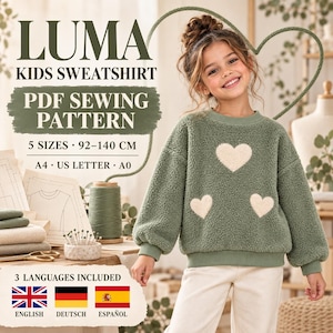 May include: LUMA KIDS SWEATSHIRT PDF SEWING PATTERN 5 SIZES 92-140 CM A4 US LETTER A0 3 LANGUAGES INCLUDED ENGLISH DEUTSCH ESPAÑOL. A sage green textured fleece sweatshirt with three cream-colored heart appliques on the front.