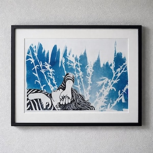 May include: A framed art print featuring a blue and white illustration. The artwork depicts a person with long hair and a striped sleeve, surrounded by stylized plant life. The print is set against a white background and framed in black.