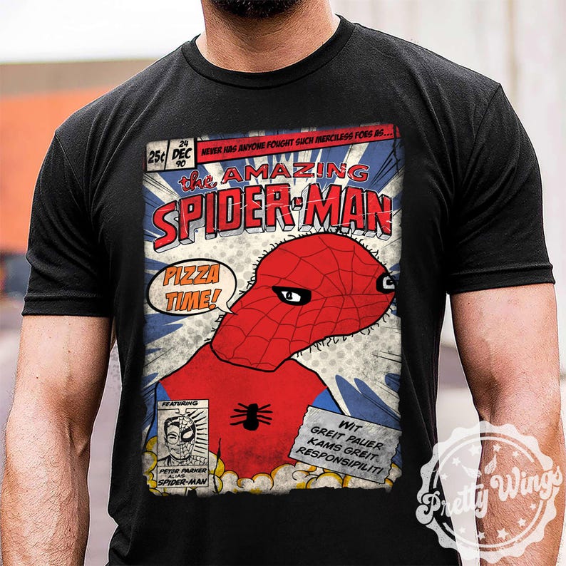 May include: Black t-shirt featuring a comic book-style graphic of Spider-Man with the text "the AMAZING SPIDER-MAN" and "PIZZA TIME!". The design includes a red and blue color scheme, with additional text and a spider emblem.