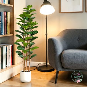 May include: A handmade wooden sign with the text "Welcome" in a handwritten style. The sign is painted white with a distressed finish, and a small, decorative heart is attached. The sign measures approximately 12 inches wide.