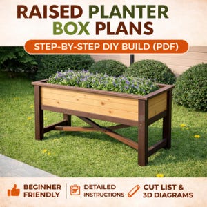May include: A wooden raised planter box with a light brown interior and dark brown frame, filled with purple flowers. The text "RAISED PLANTER BOX PLANS" and "STEP-BY-STEP DIY BUILD (PDF)" are displayed at the top. The words "BEGINNER FRIENDLY", "DETAILED INSTRUCTIONS", and "CUT LIST & 3D DIAGRAMS" are also visible.