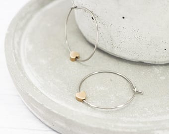 Titanium polished 1 inch hoops, Brass heart dangle charm, Hypoallergenic earrings - Mixed metal